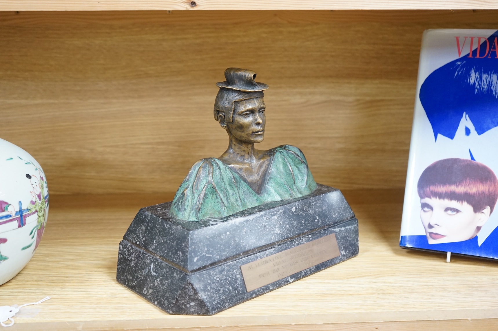 A figural bronze award: Alternative Hair Show Award Vidal Sassoon for 50 Years Creativity October 1993, together with Vidal Sassoon Fifty Years Ahead, a photographic history of his work. Award 29cm wide x 25cm high.